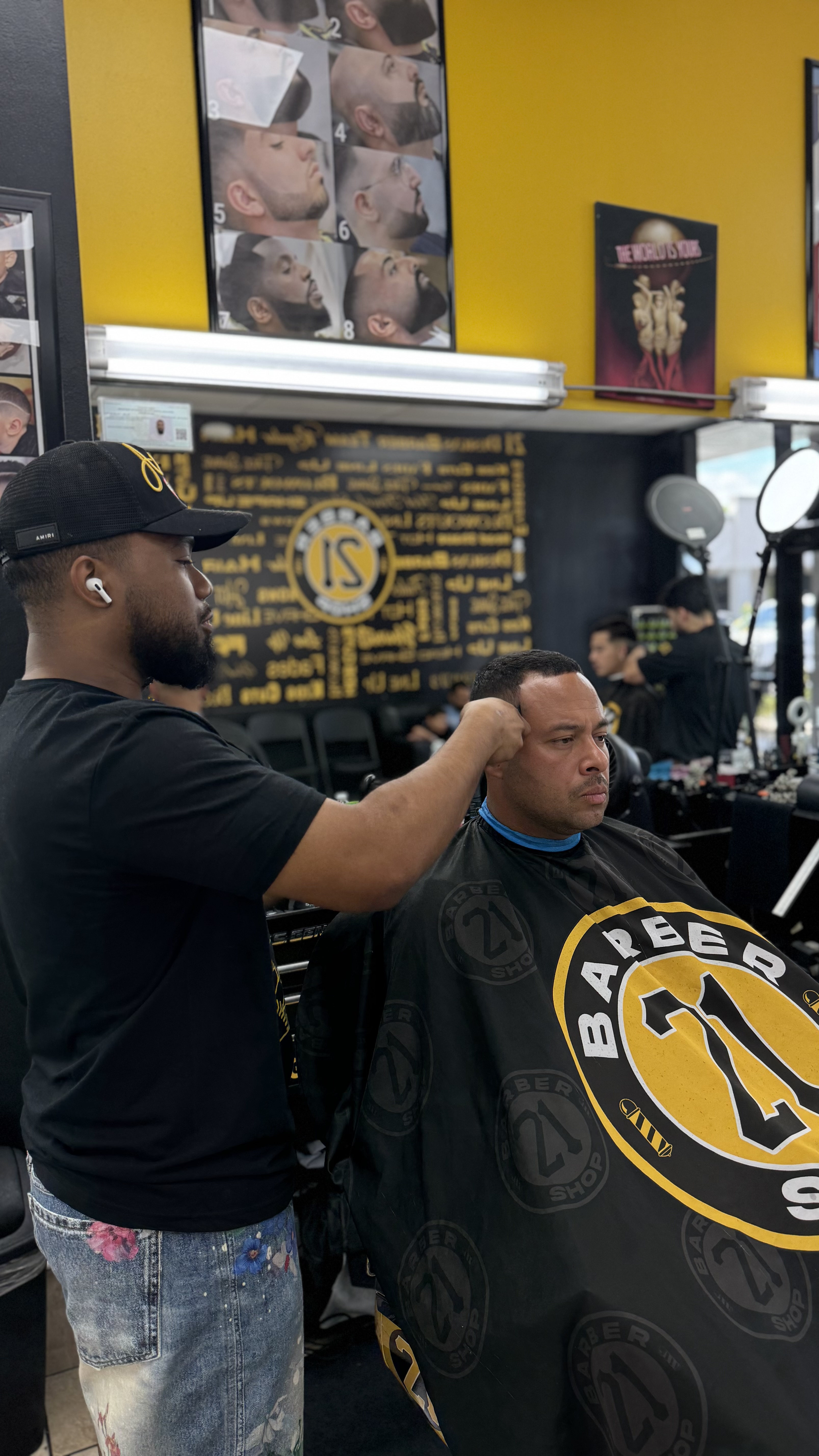 Barber performing haircut close up