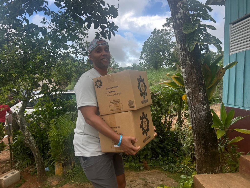 Carrying Kids Around the World food program boxes