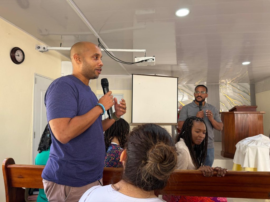 Sharing testimony with a microphone during a community gathering