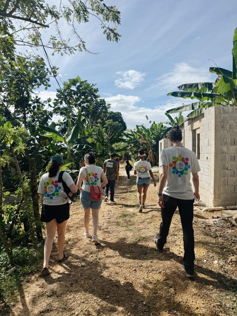 Mission team walking through a rural Dominican Republic village
