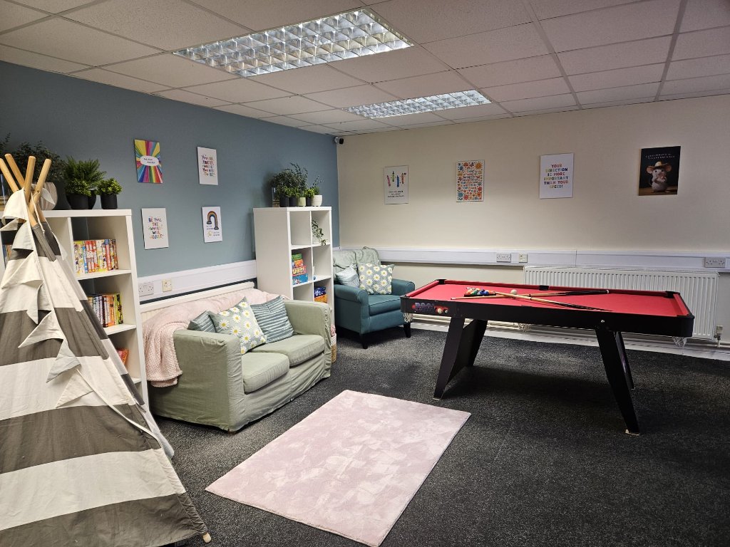 Main social space with pool table and seating