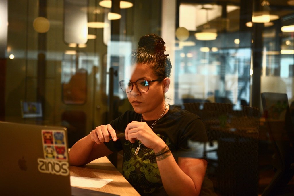 Working on Arrivli at a desk by a window