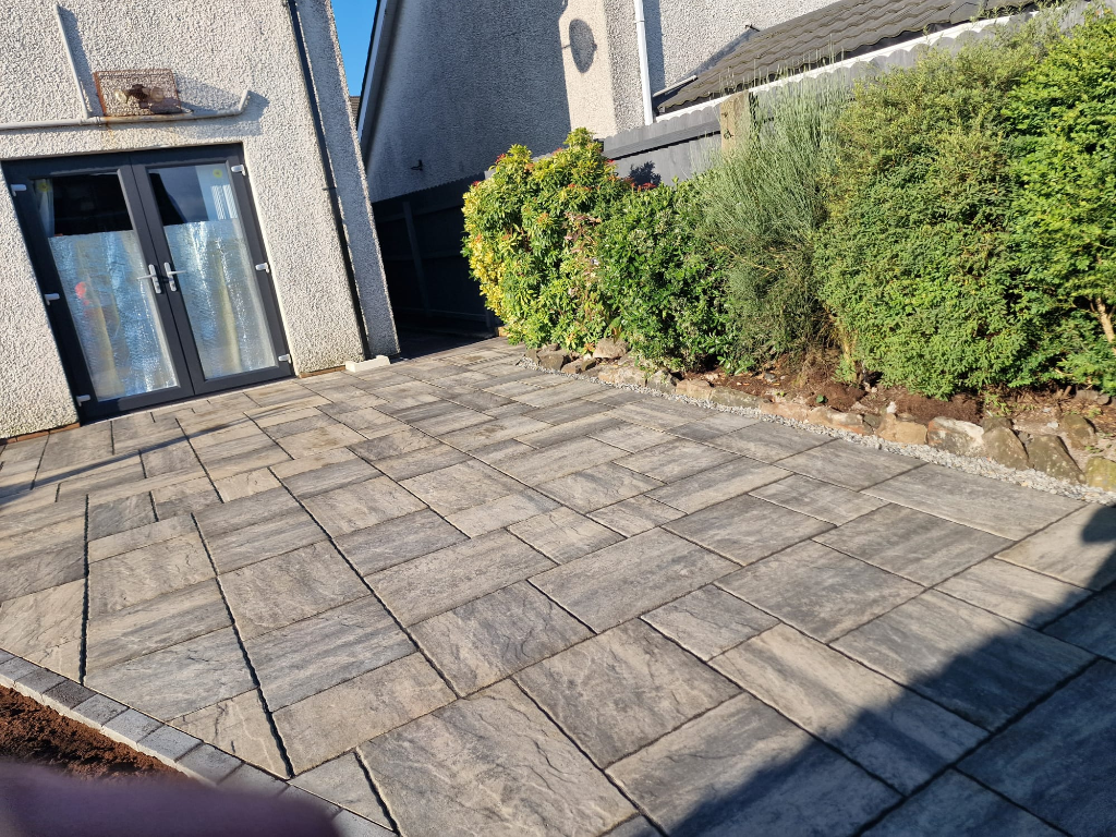 Finished sandstone patio at dusk