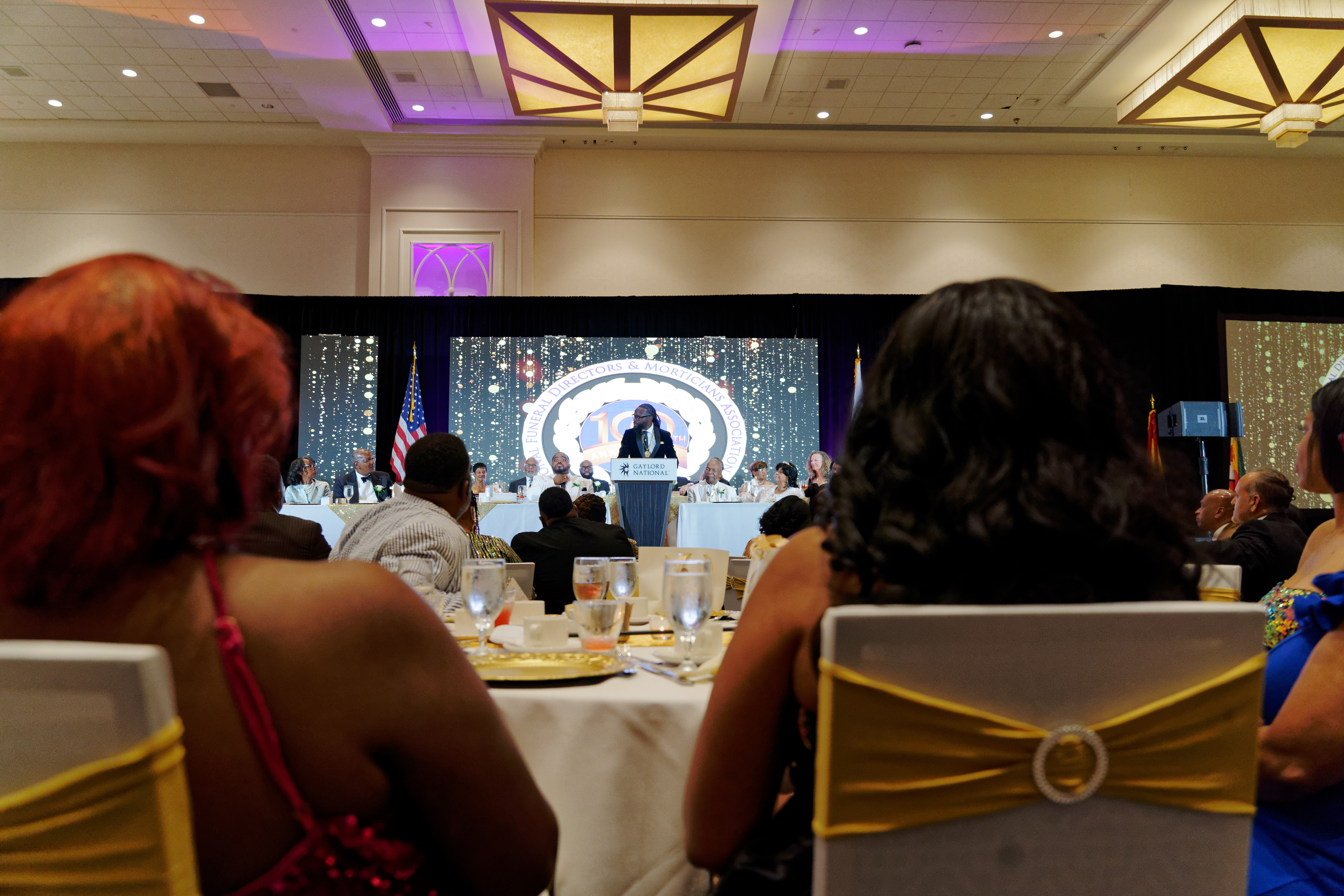 Gala audience facing the stage and screen at the NFDMA 100th Year Gala — Bmore Pro Productions