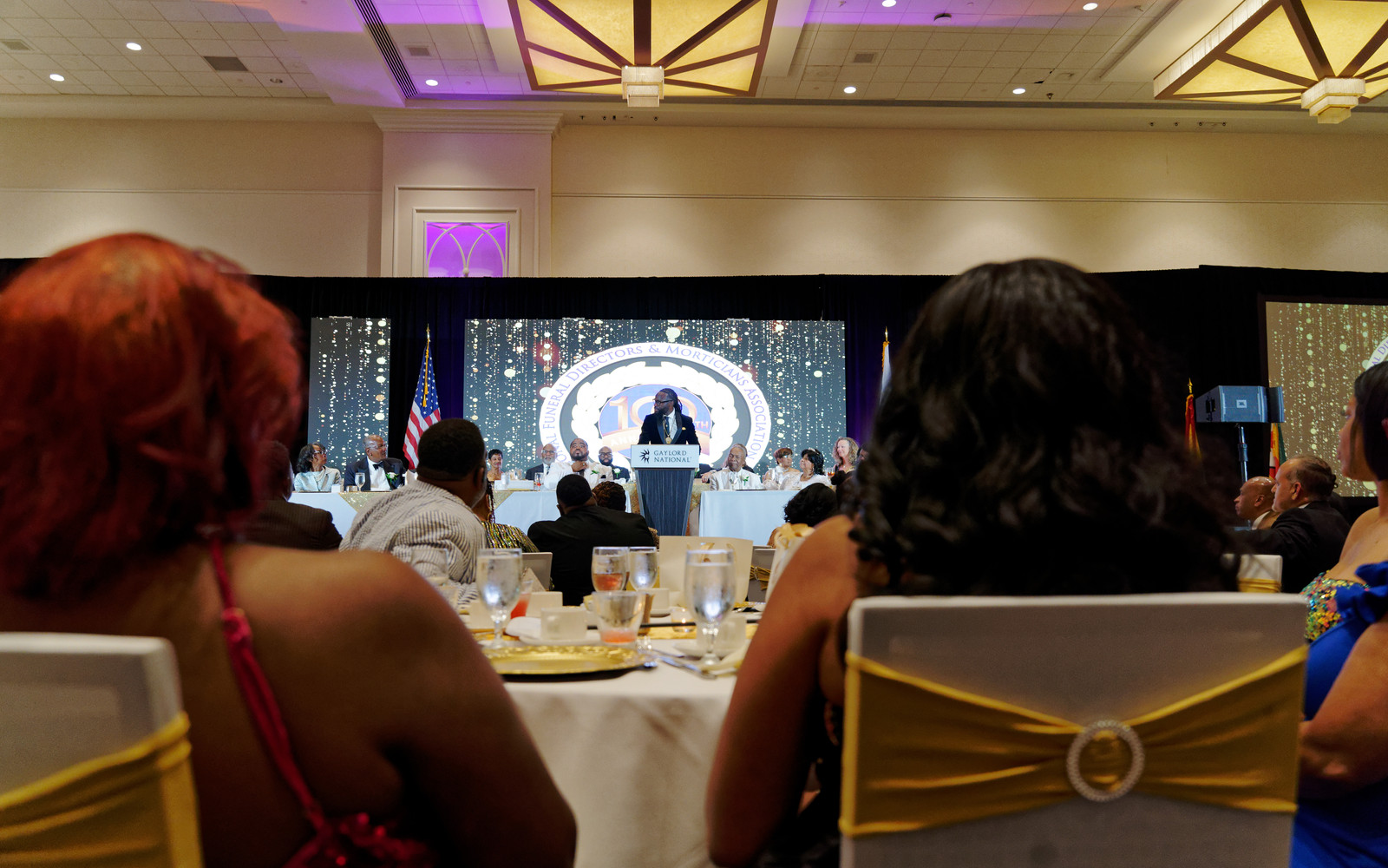Gala audience facing the stage and screen at the NFDMA 100th Year Gala — Bmore Pro Productions