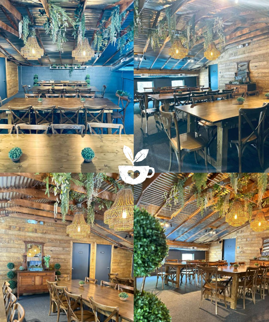 Private loft at Botanic Cafe — wood tables, hanging greenery, chandeliers, exposed beams