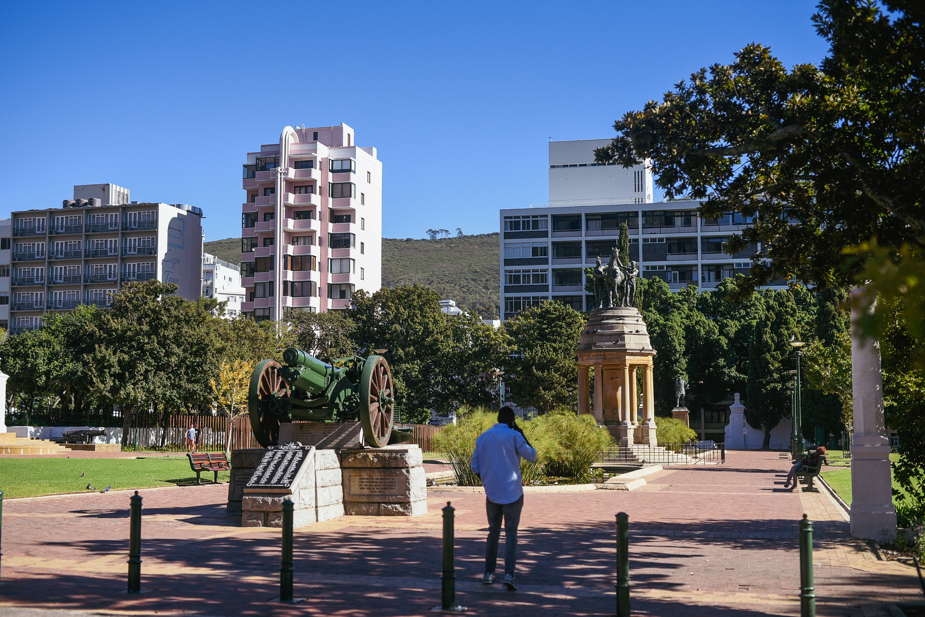 Monuments and a historic field gun along the paths of the Company's Garden