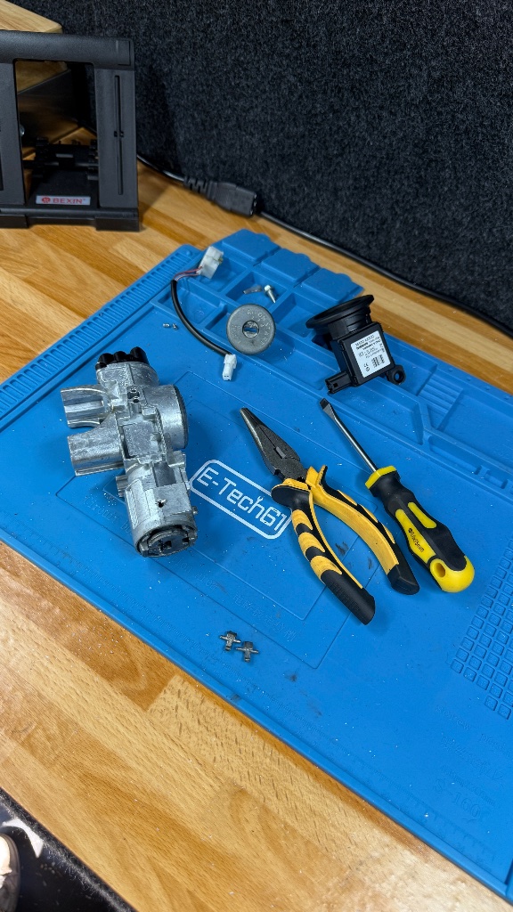 Disassembled Nissan Micra ignition barrel showing internal components