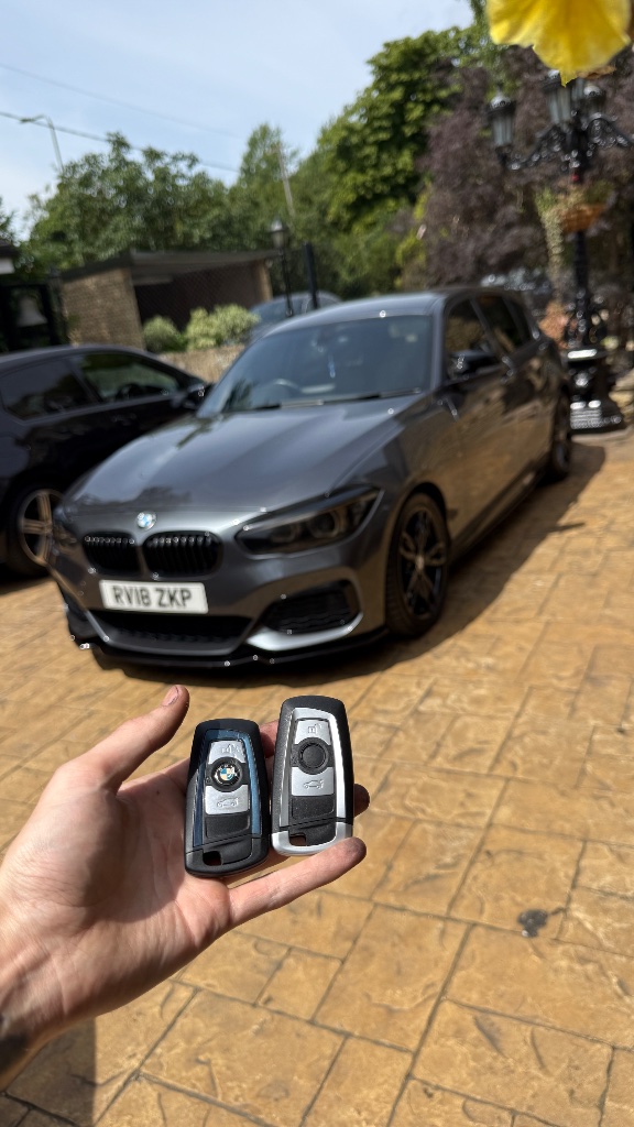 BMW M140i on the customer's driveway with two newly supplied key fobs by KeyLogik in Abingdon, Oxfordshire
