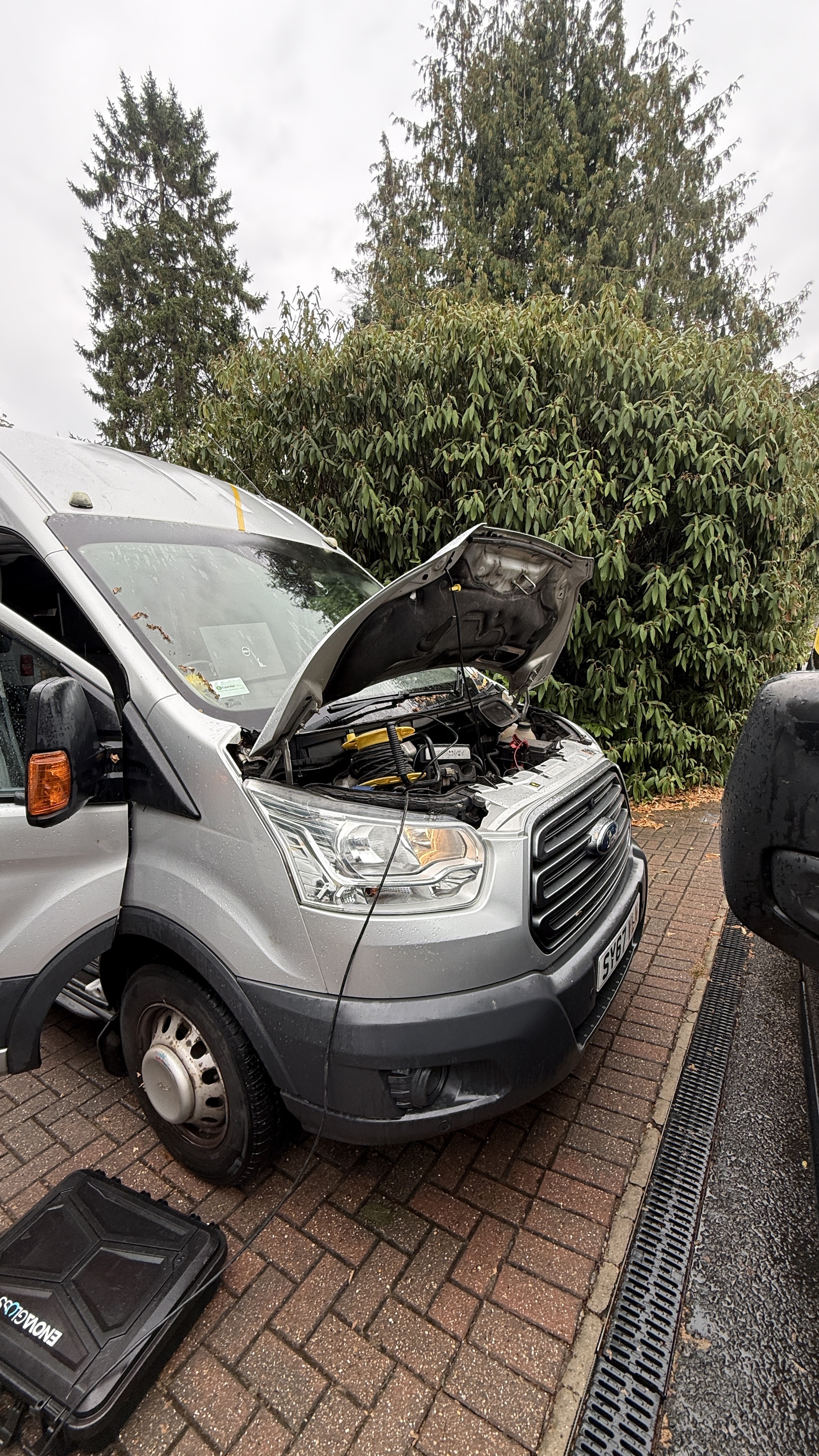 Silver Ford van with bonnet raised during on-site diagnostics by KeyLogik mobile auto locksmith