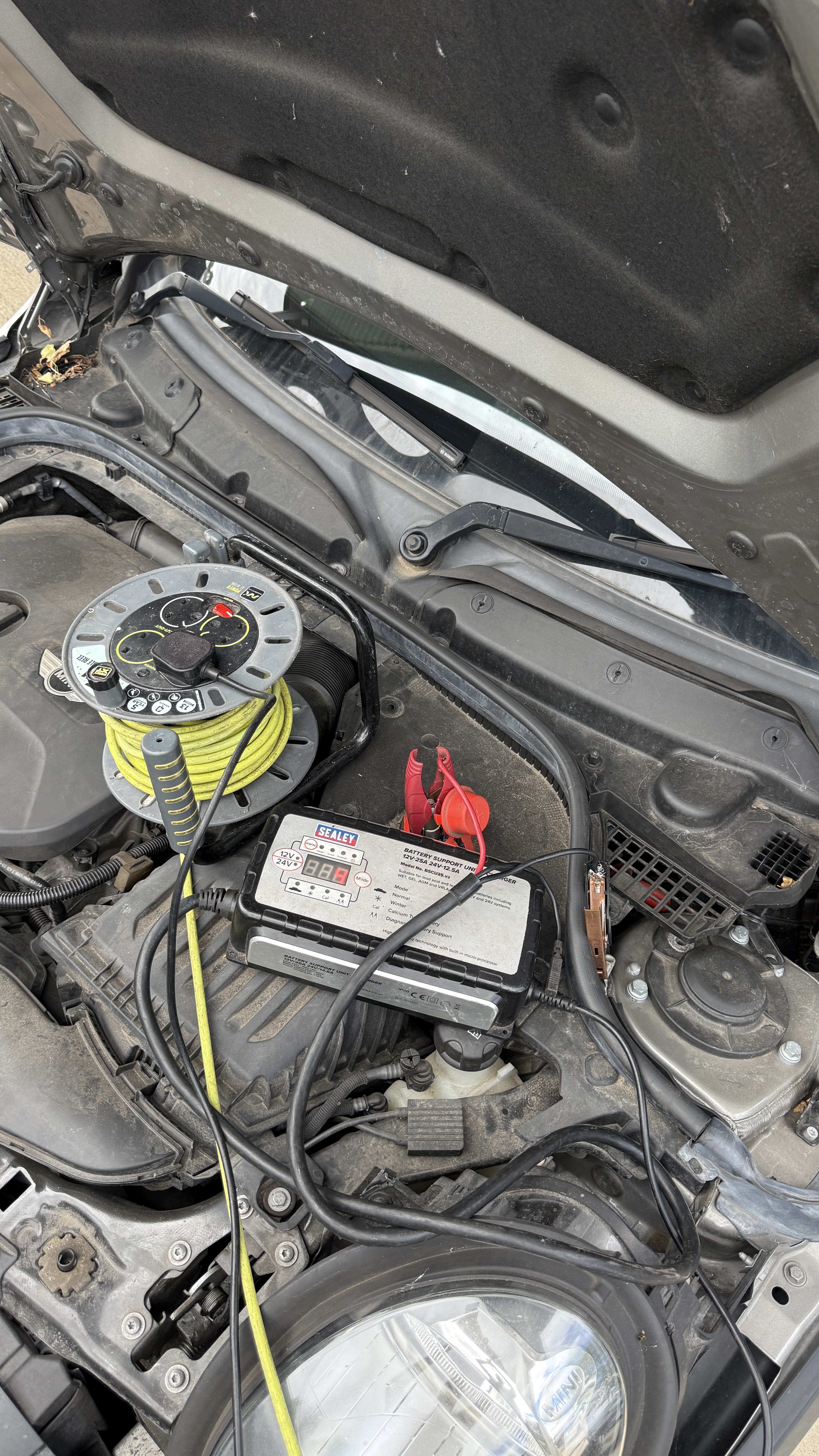 Sealey professional battery support unit connected to a Mini engine bay during ECU remapping by KeyLogik