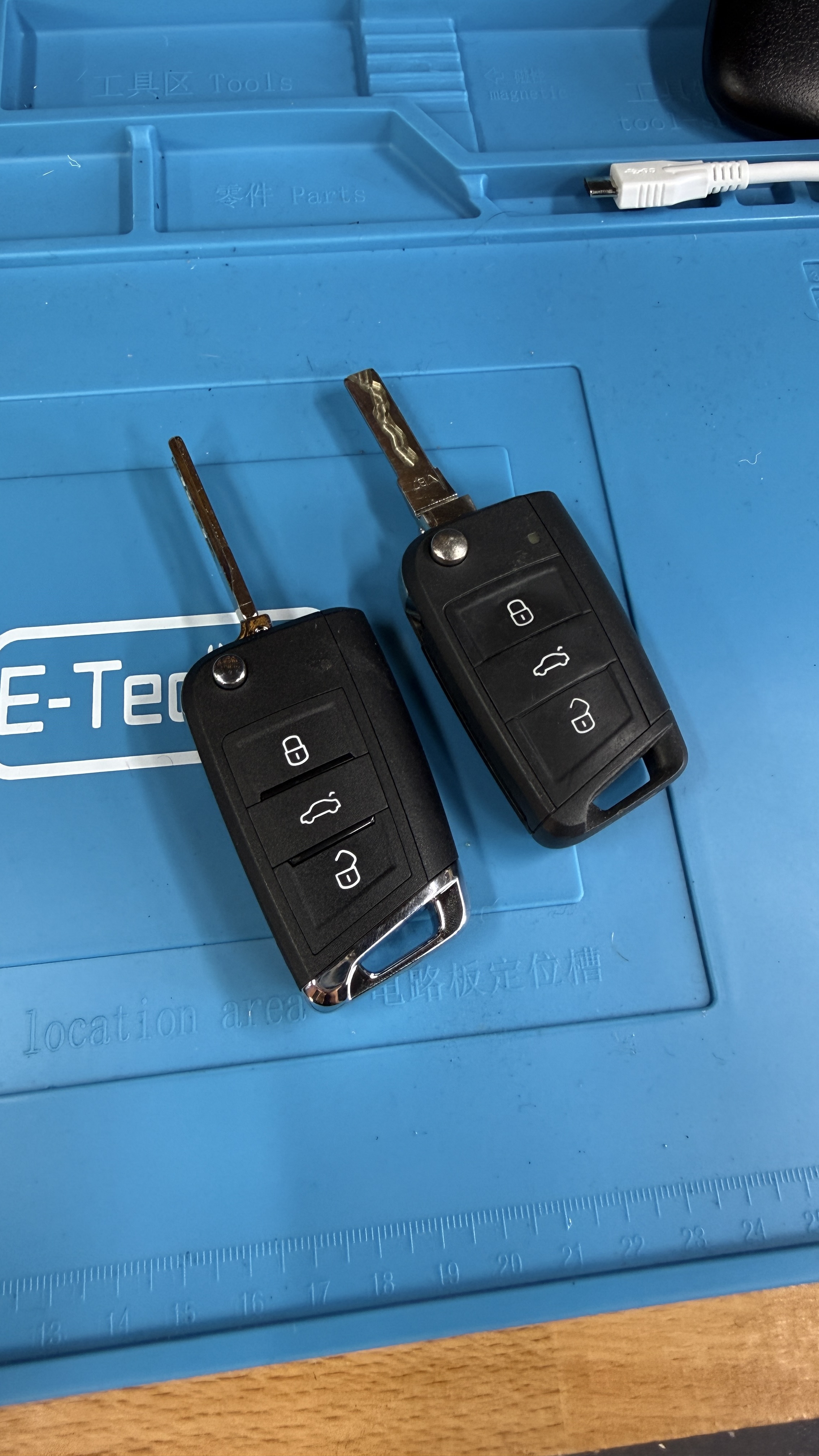 Genuine Volkswagen flip key fobs on the KeyLogik workbench