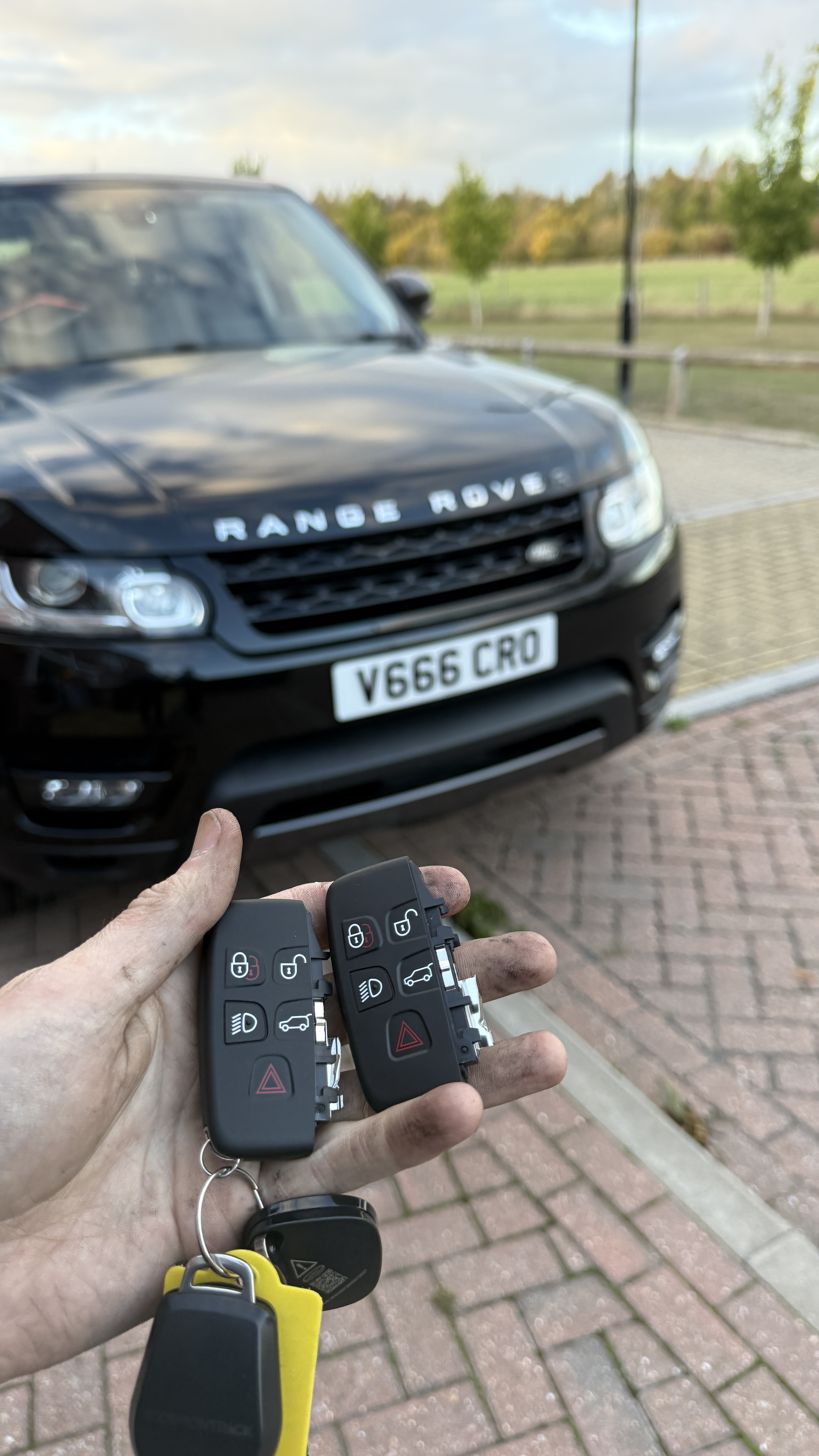 Two Range Rover proximity smart key fobs supplied and programmed by KeyLogik mobile auto locksmith