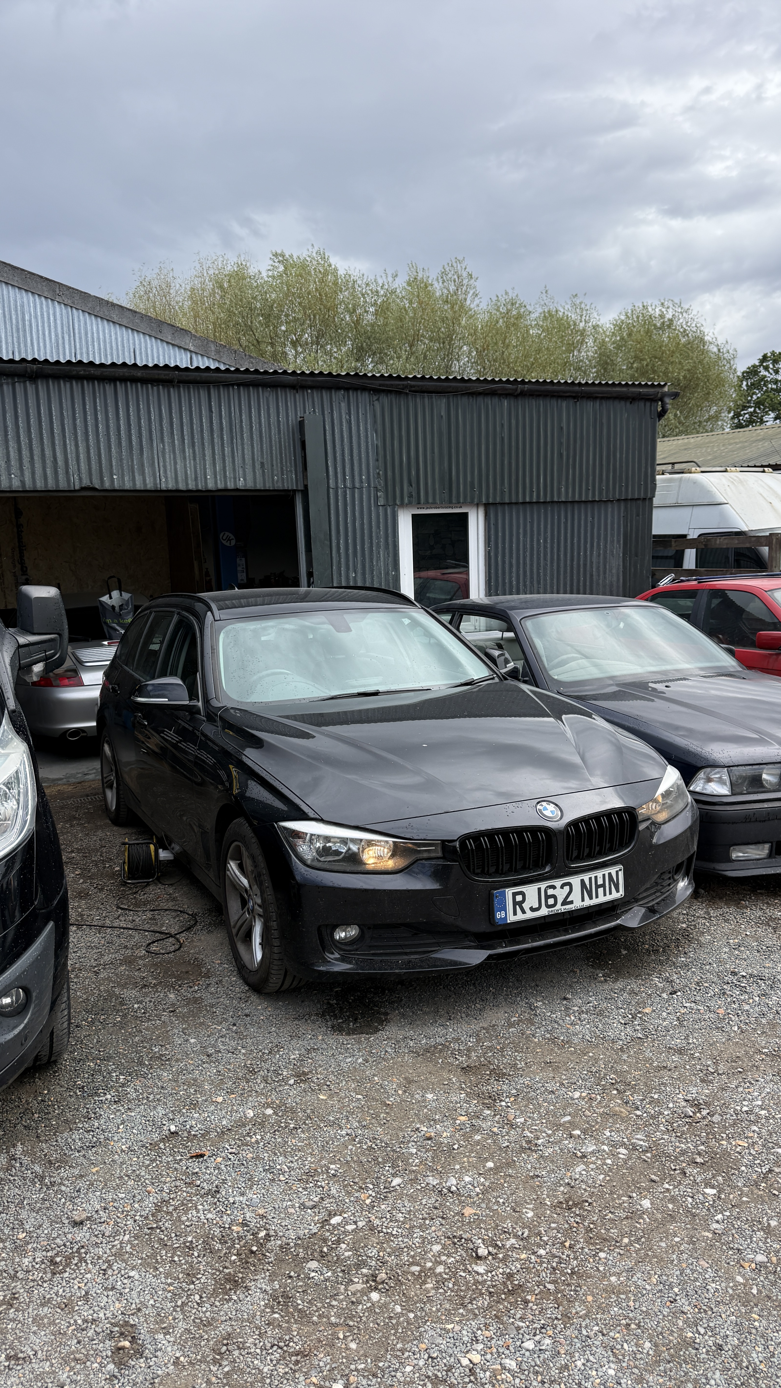 Black BMW 3 Series estate attended by KeyLogik mobile auto locksmith