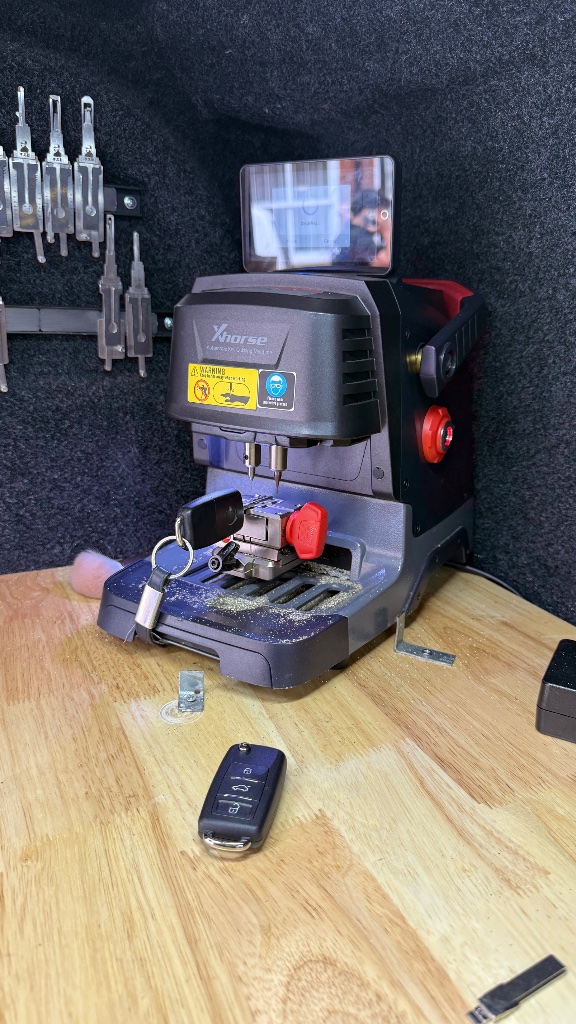 Xhorse automatic key cutting machine cutting a new VW Caddy key blade at the customer's location in St Clements, Oxford