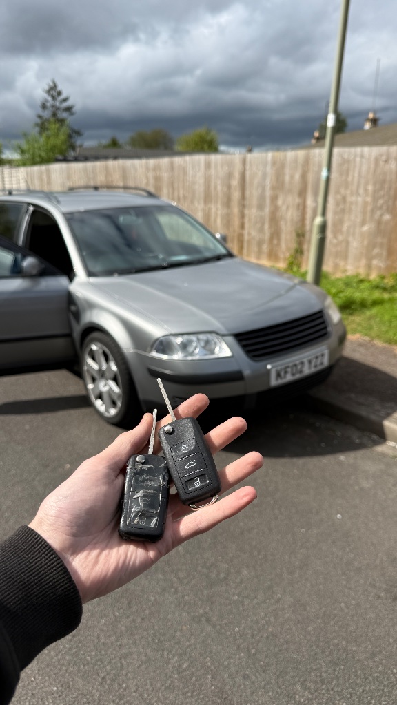 Worn original VW Passat key alongside new OEM-style replacement key supplied by KeyLogik in Oxford