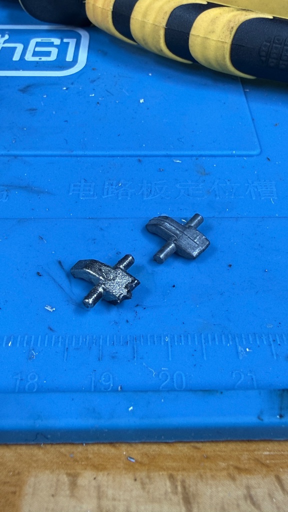 Comparison of a worn Nissan Micra ignition trigger beside a new replacement trigger