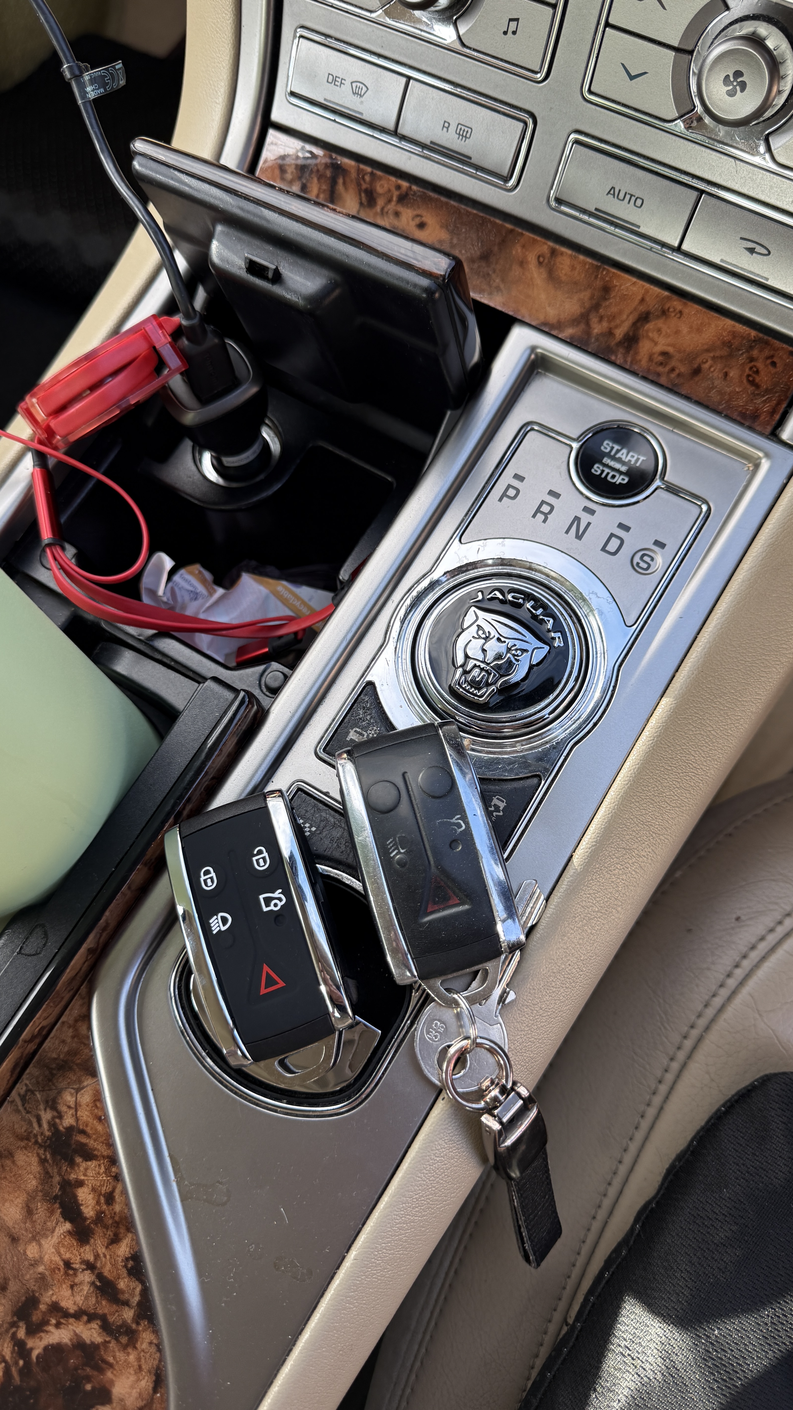 Two Jaguar key fobs supplied and programmed and placed on the gear selector by KeyLogik