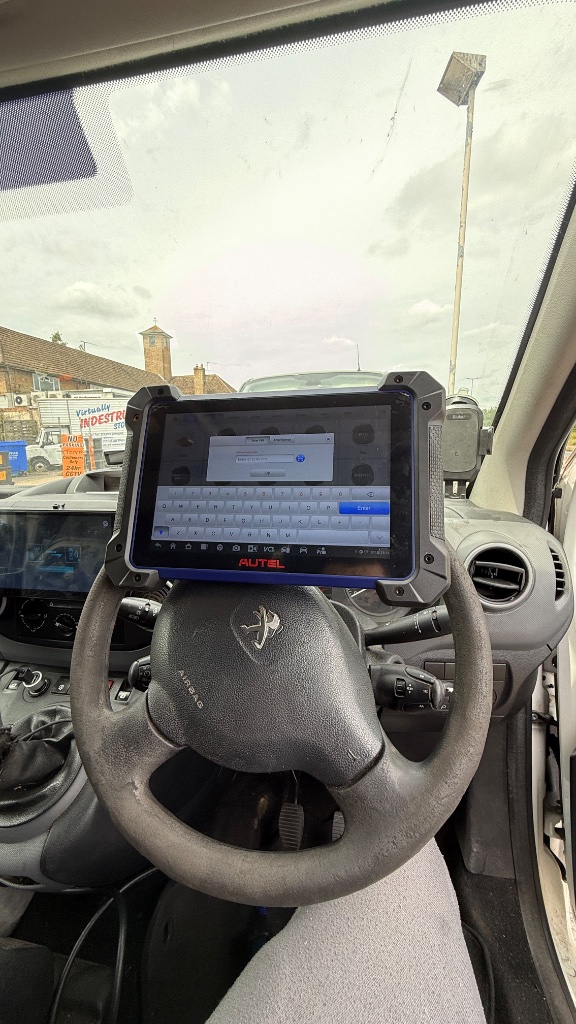 Peugeot Partner key programming diagnostics by KeyLogik in Banbury