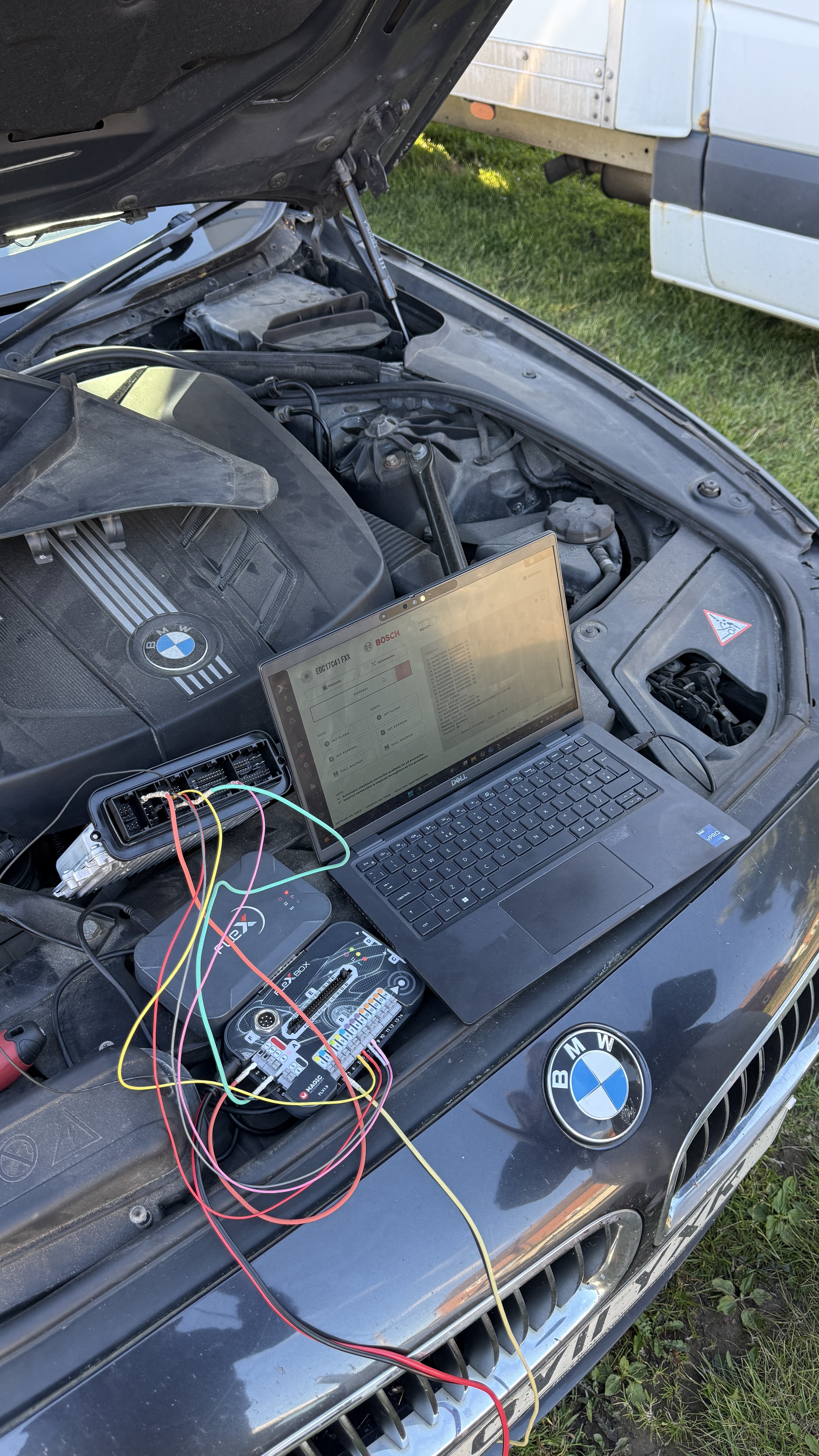 BMW 520d engine bay with ECU removed and connected to FlexBox and Dell laptop running Bosch EDC17 programming software, Stage 1 remap carried out by KeyLogik in Woodcote, Oxfordshire