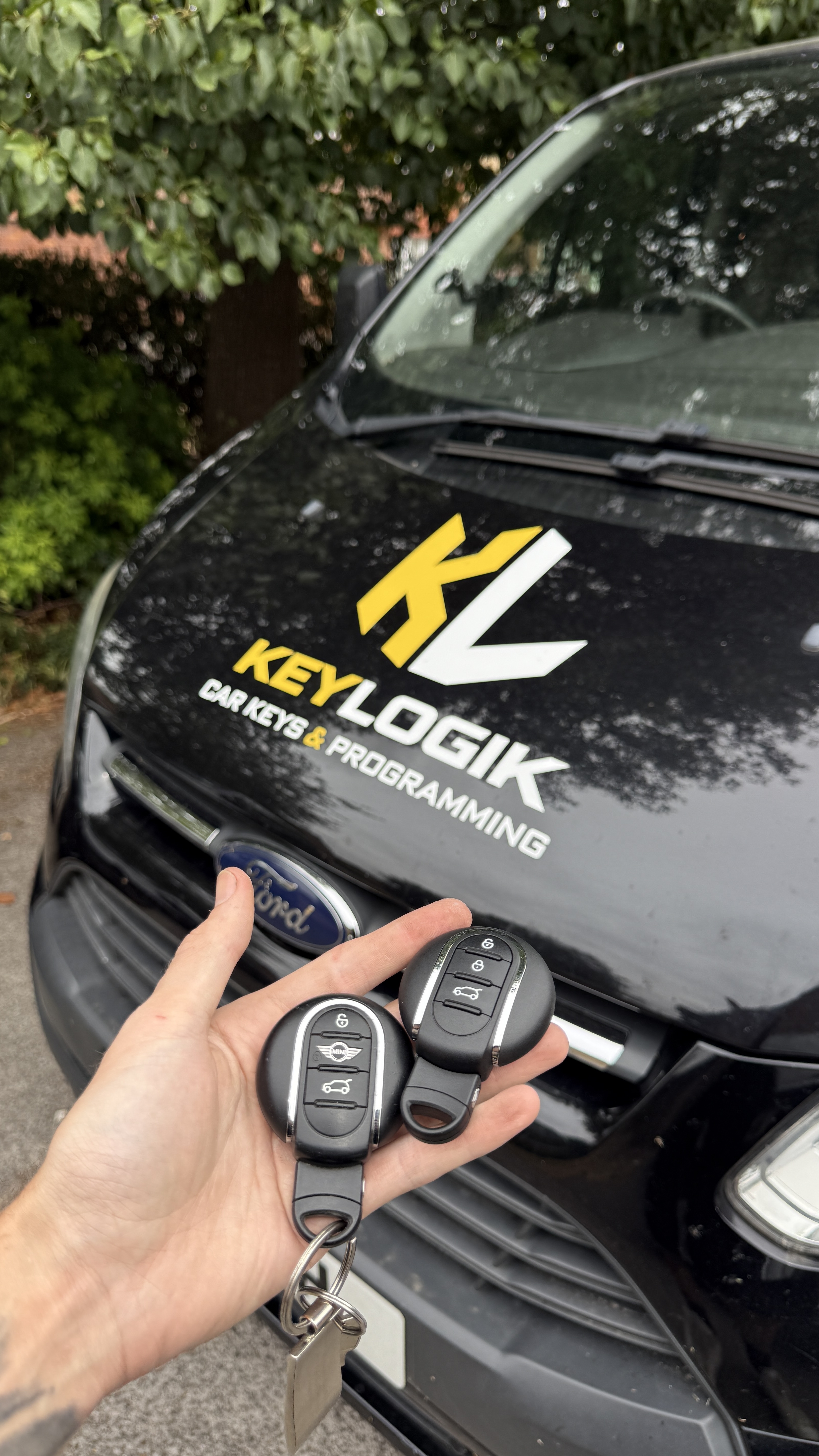 KeyLogik mobile auto locksmith van and Mini car key fobs ready for programming