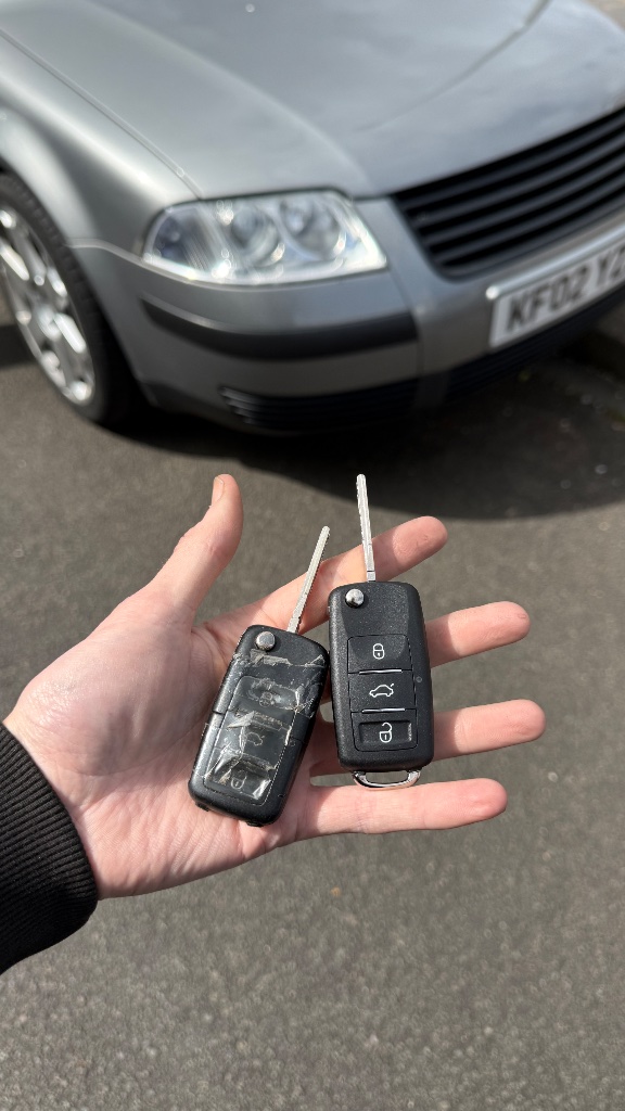 New VW Passat spare key held in front of the vehicle during programming in Oxford