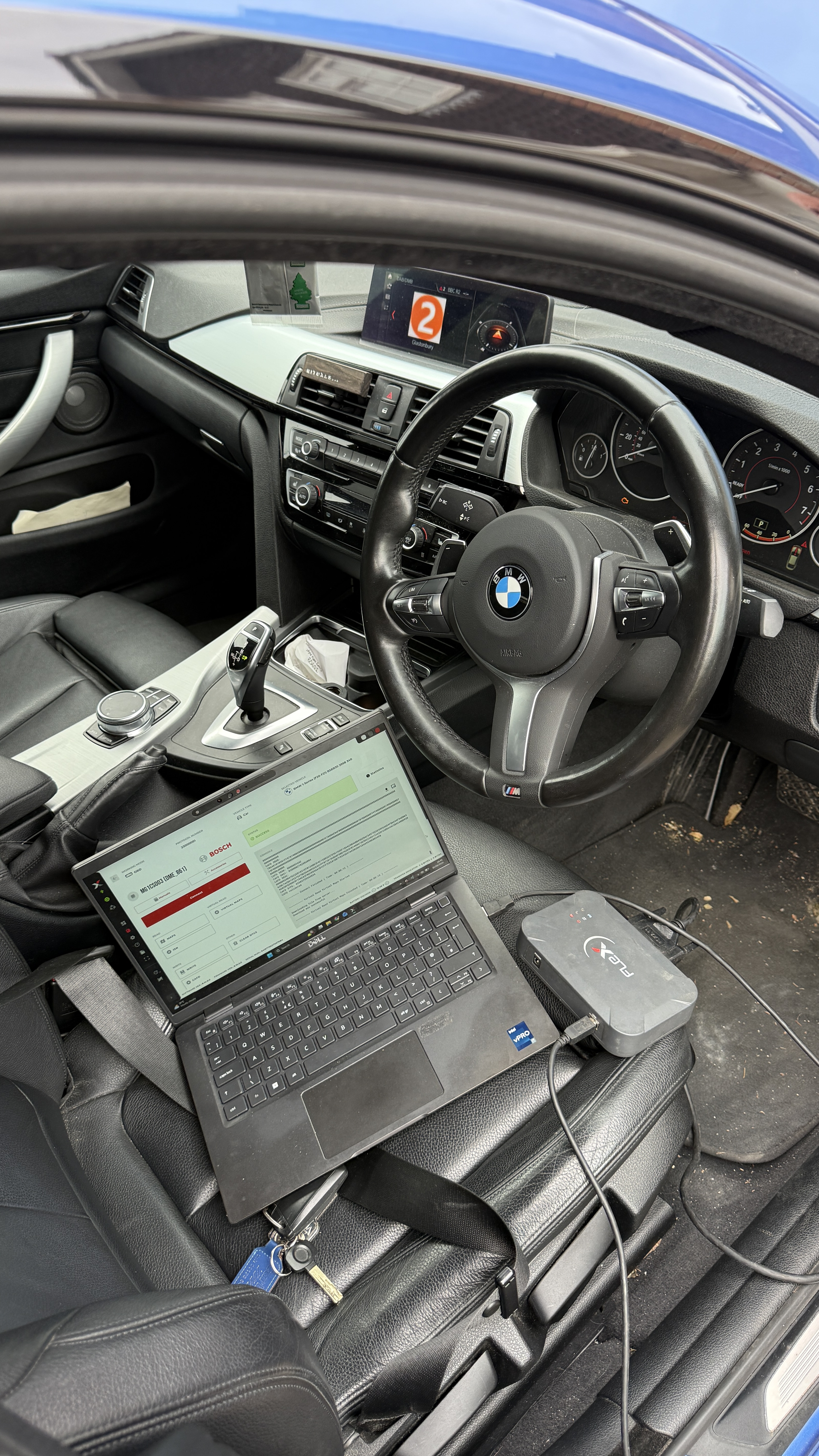 BMW B48 420i interior with Dell laptop running Bosch ECU remapping software connected via FlexBox diagnostic tool, Stage 1 remap carried out by KeyLogik in Swindon