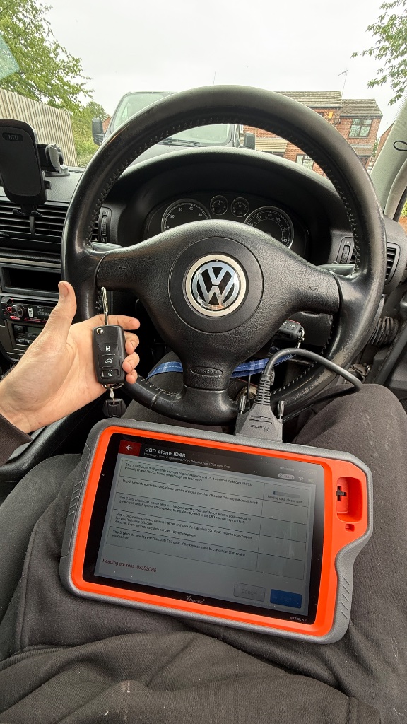 Xhorse Key Tool Plus diagnostic tablet during VW Passat key programming in Oxford