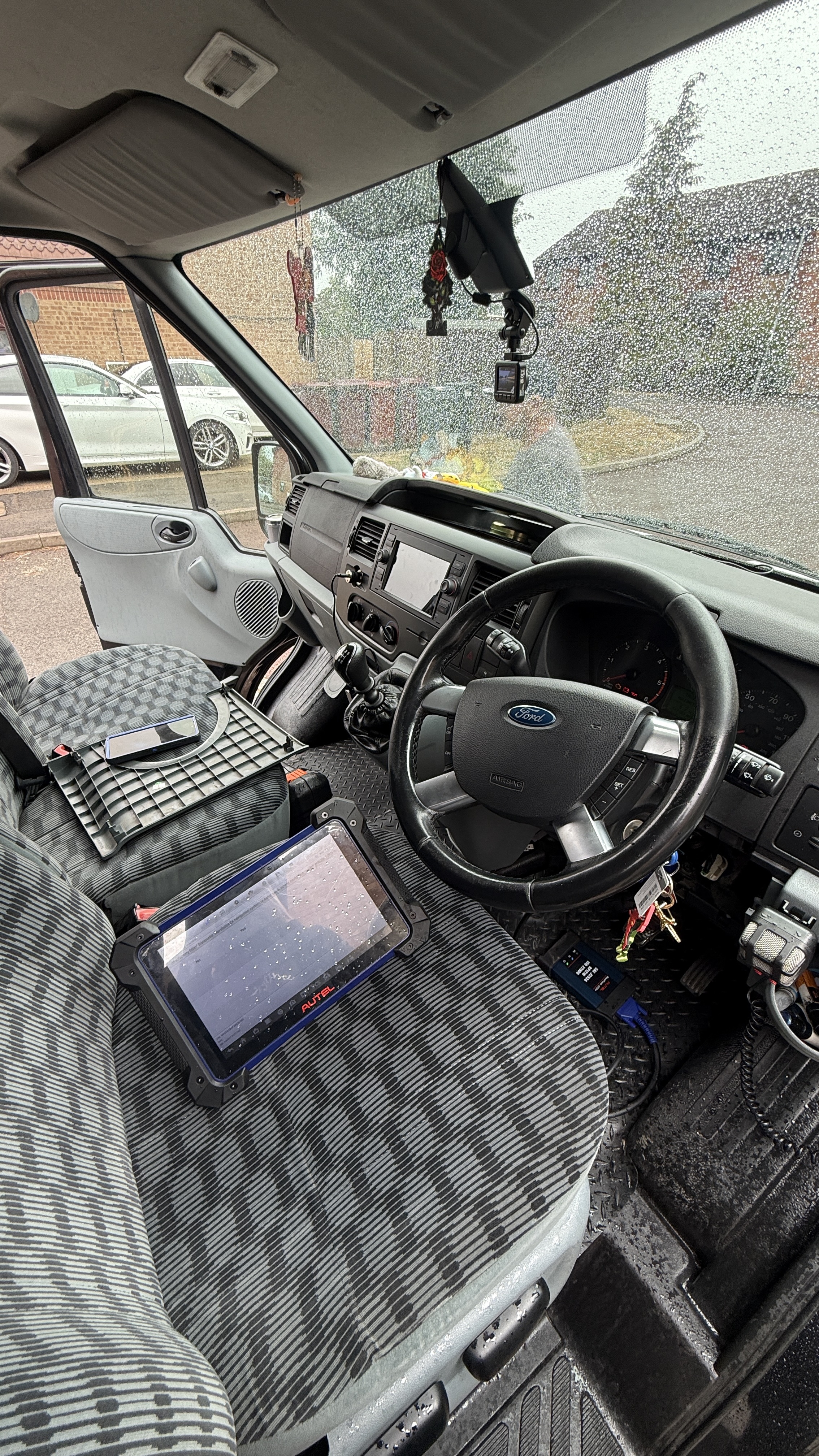 Ford Transit interior with Autel diagnostic tablet during on-site key programming by KeyLogik