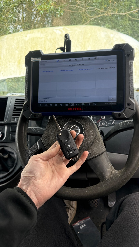 Autel diagnostic tablet showing remote control learning during Volkswagen Transporter key programming in High Wycombe