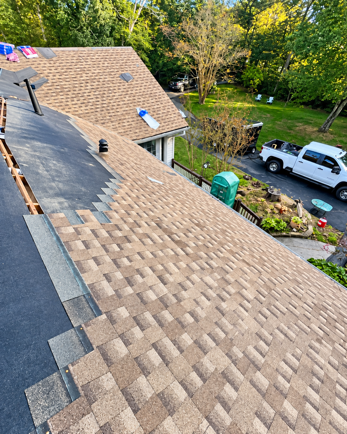Completed roofing installation with new shingles by Grounded LLC