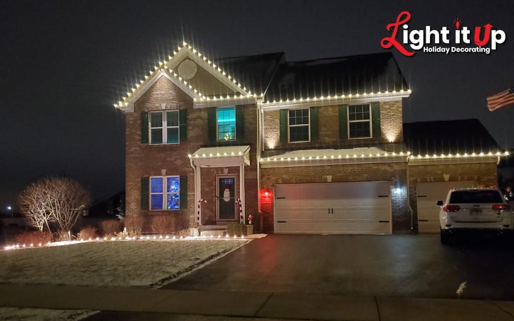 Classic warm white roofline Christmas lights on brick home
