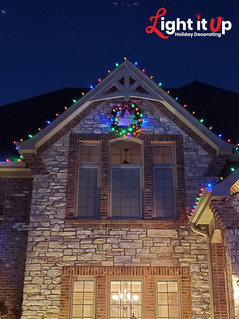 Multicolor wreath with roofline lights close-up detail