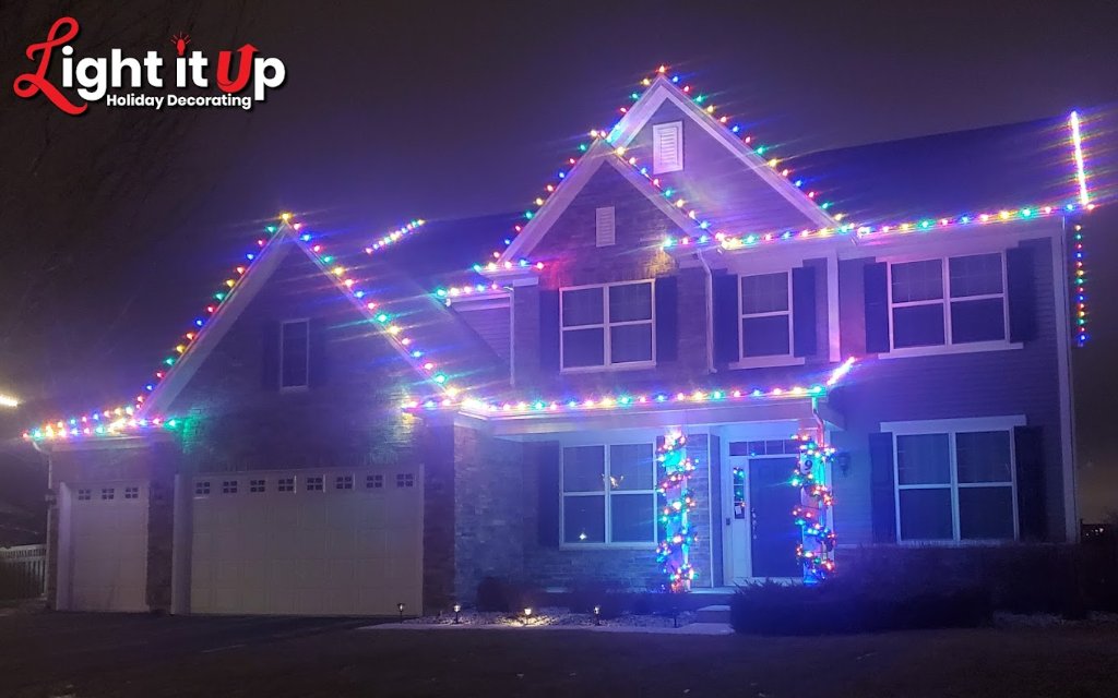 Multicolor roofline Christmas lights with garland columns