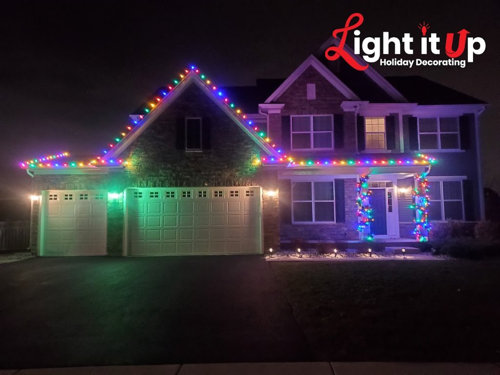 Multicolor roofline Christmas lights on craftsman home
