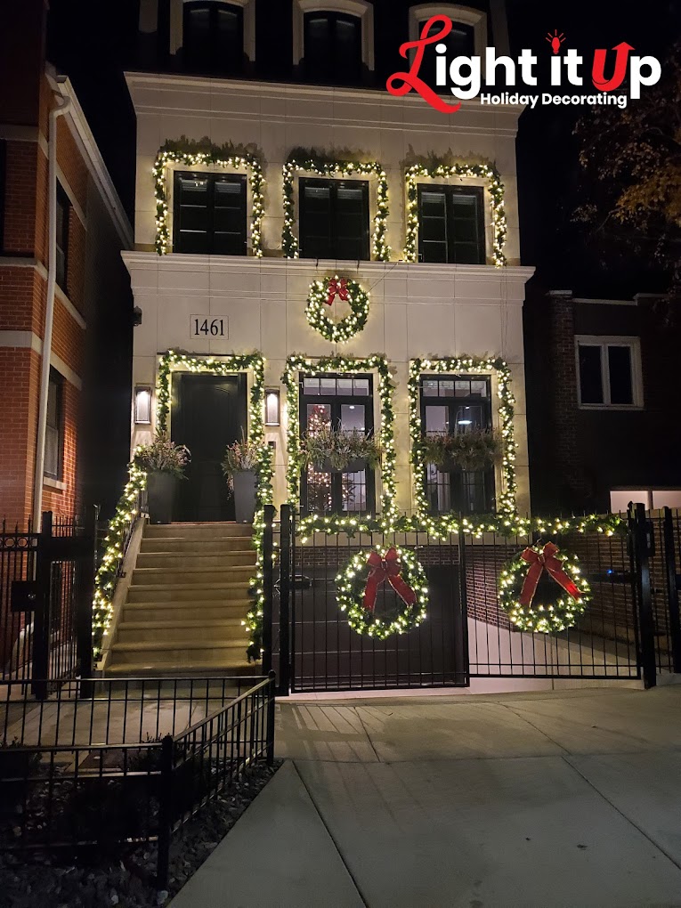 Chicago brownstone with full garland, wreaths and warm white lights