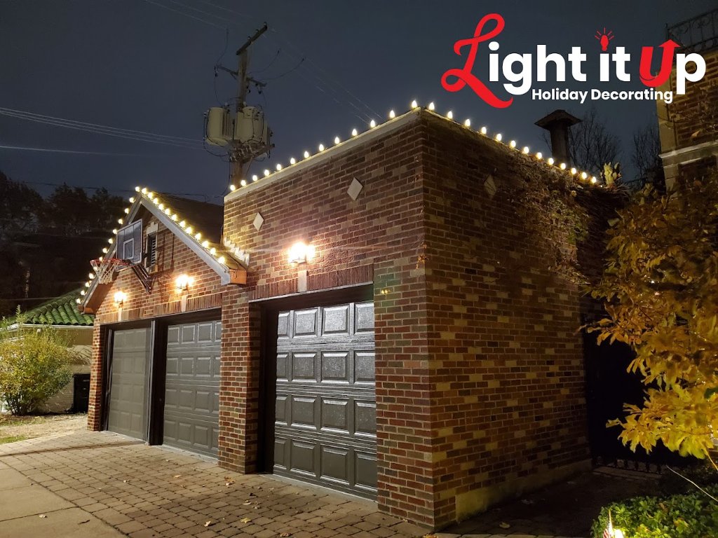 Classic warm white roofline lights on brick garage