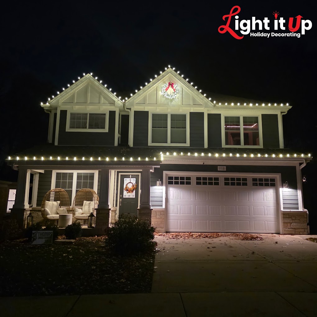 Warm white roofline Christmas lights on craftsman home with wreath