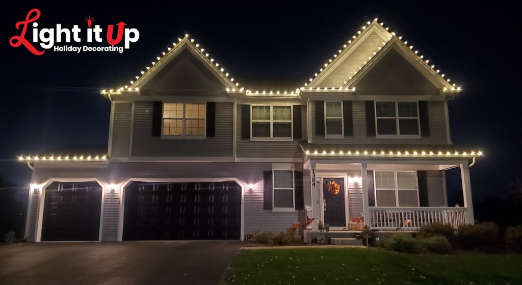 Warm white roofline Christmas lights on large craftsman home