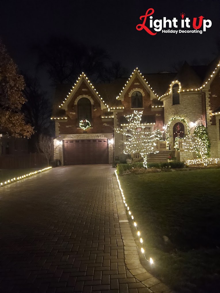 Warm white roofline, pathway and outer wrapped tree on stone home