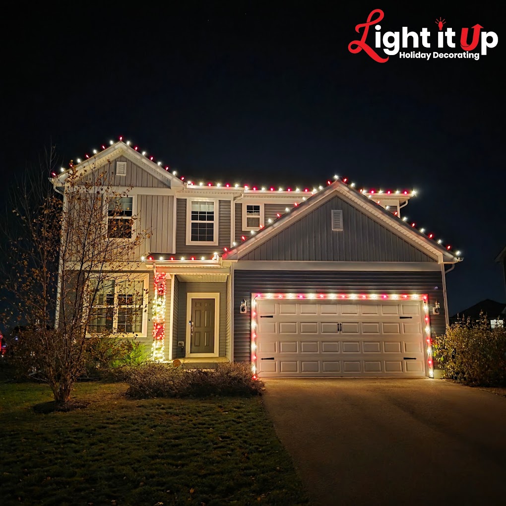 Red and white roofline and bush Christmas lights on craftsman home