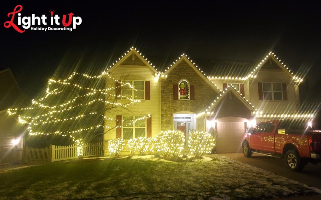 Warm white roofline and outer wrapped tree Christmas lights