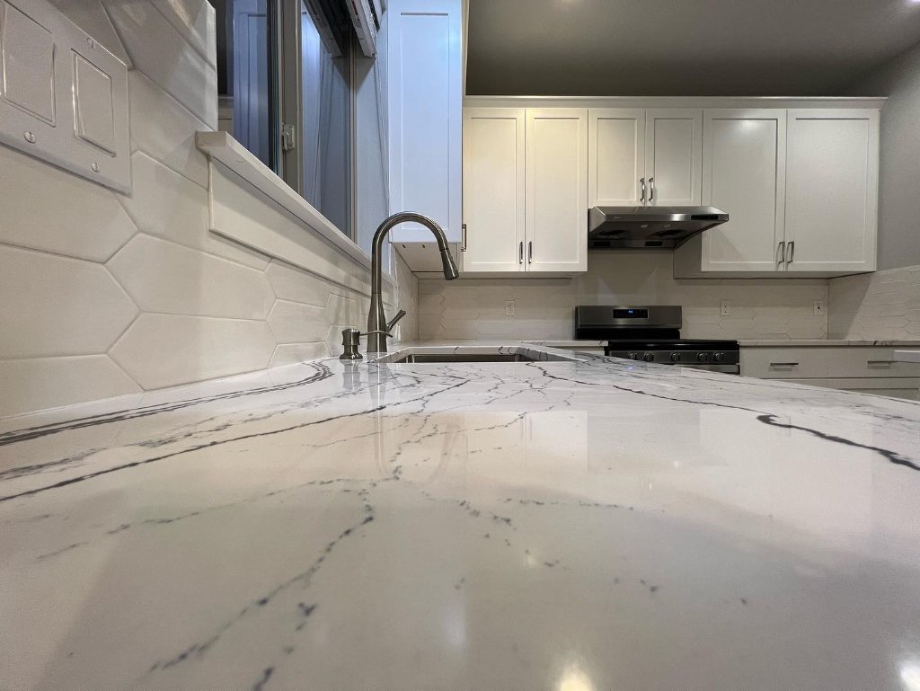 White Kitchen with Herringbone Backsplash