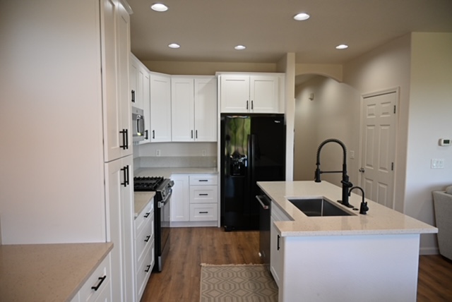 Kitchen Remodel - White Cabinets Black Fridge Close