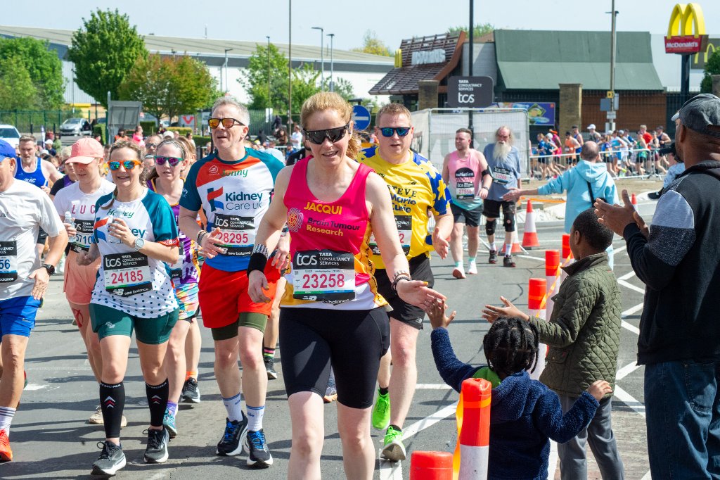 Brian Whizz Kidz runner waving at camera