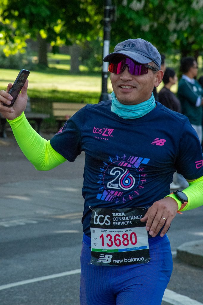 Runners past children in fairy wings giving high fives
