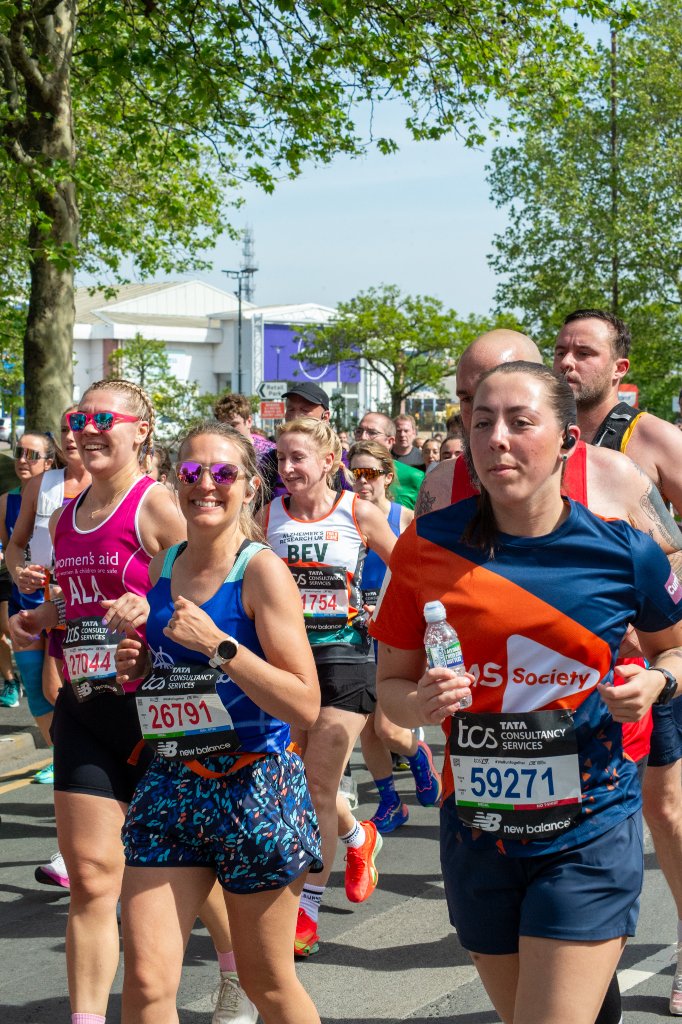 Scottish Huntingtons runner waving phone
