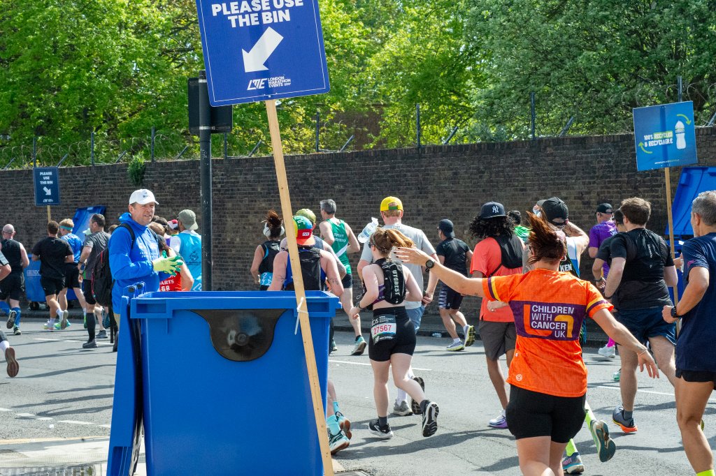 Children in fairy costume giving high five to a runner