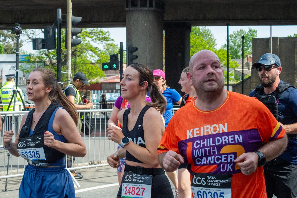 Runners heading toward the finish with London skyline