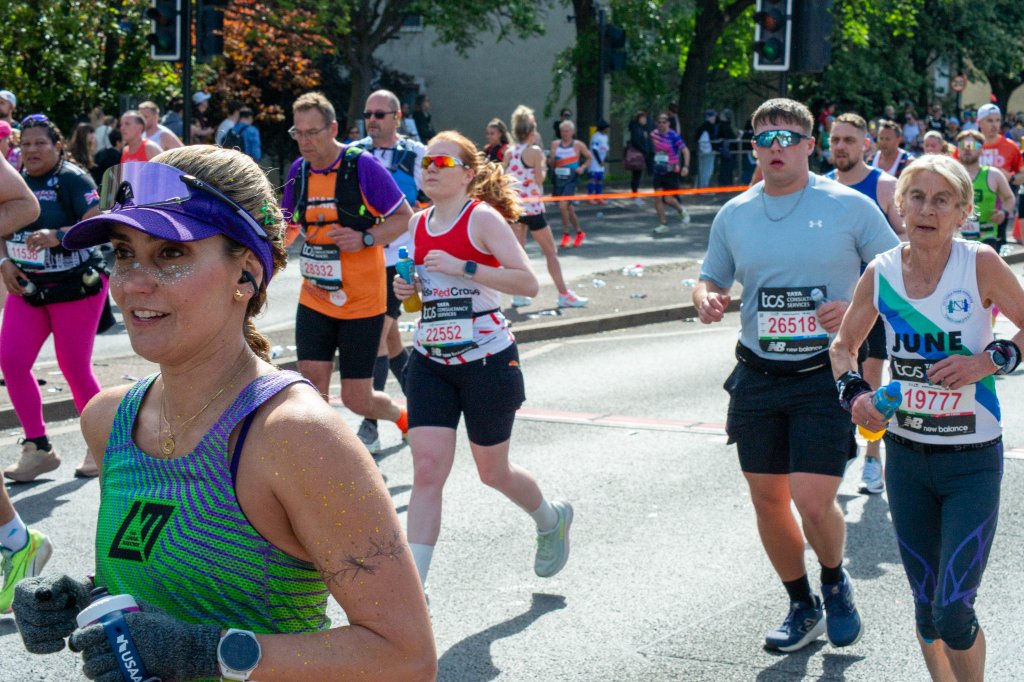 Runner holding a Mario mushroom Power-Up sign